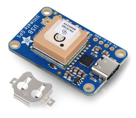 The ultimate gps gnss module lies on a white background along with the element included in the kit.