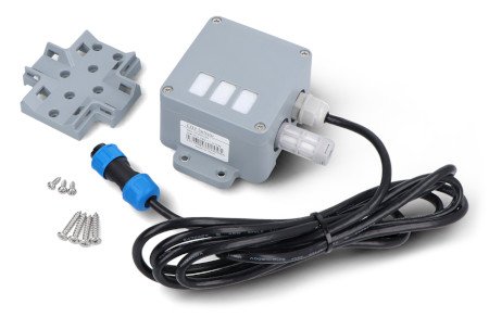 The gray sensor module lies on a white background along with the kit components.