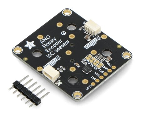 The black encoder module lies on a white background with additional pins.