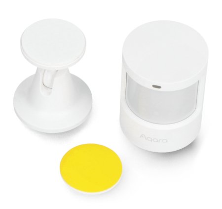 Three components of a disassembled sensor lie on a white background.