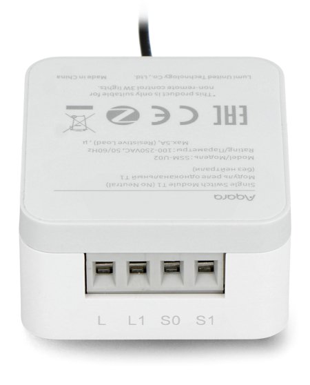 A white flush-mount relay with visible inputs and outputs lies on a white background.