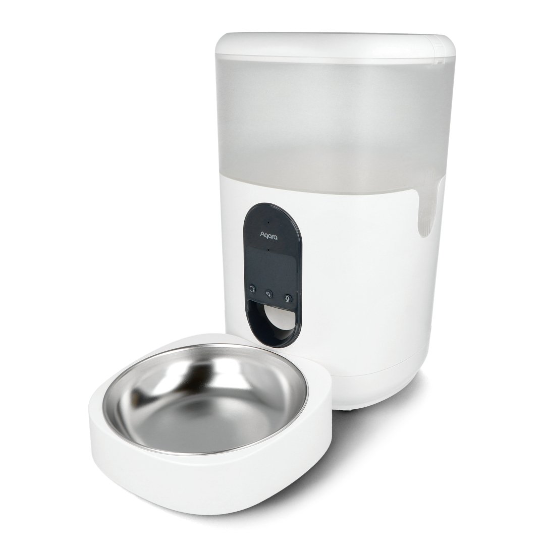 A tall white food feeder and a bowl stand on a white background.