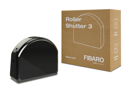 The Fibaro roller shutter controller in a black casing lies on a white background with a box.