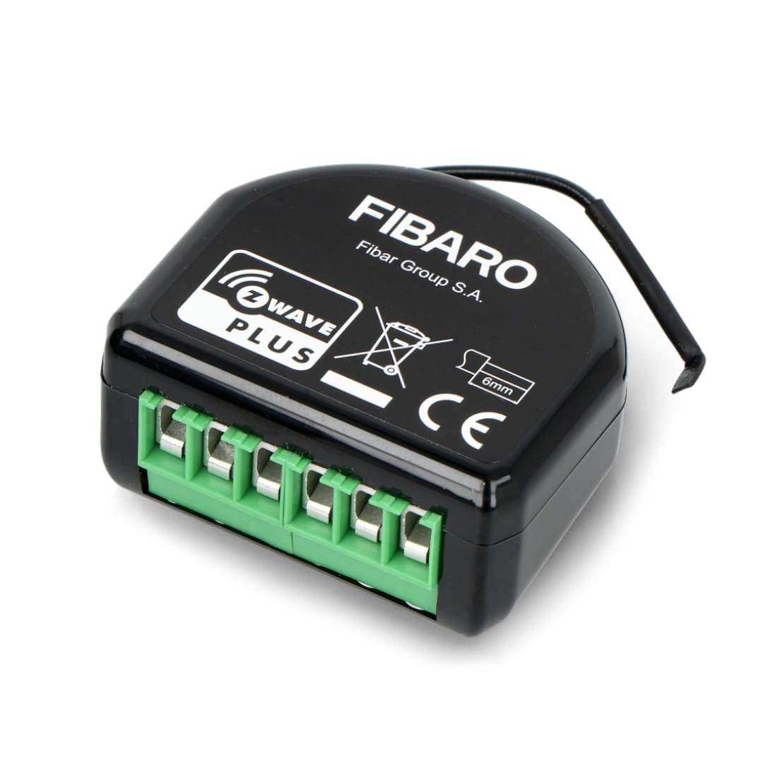 The black Fibaro Double Switch 2 relay lies on a white background.