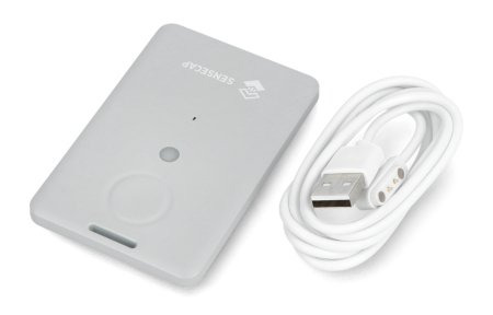 A light gray portable GPS tracker lies on a white background with an attached cable.
